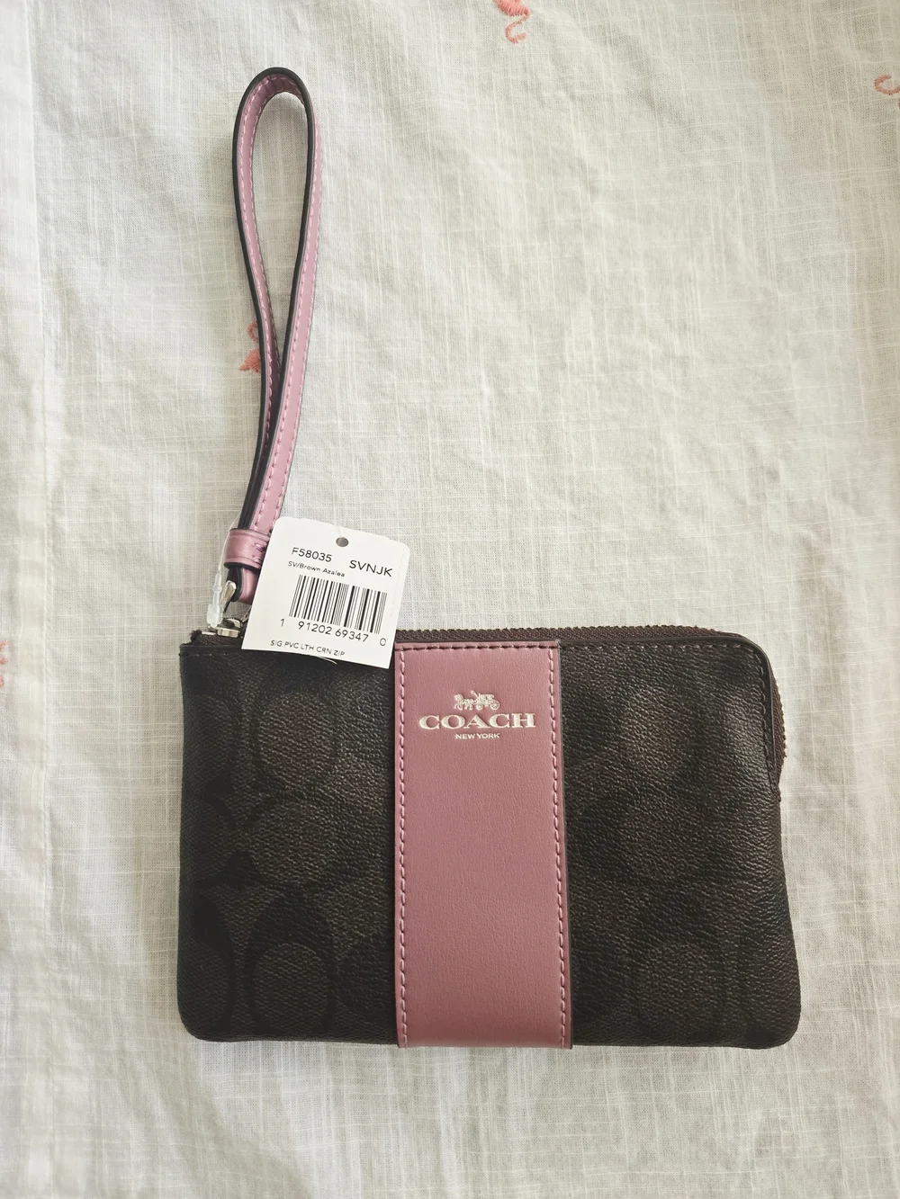 COACH Signature Wristlet Pouch in Brown and Dusty Pink
